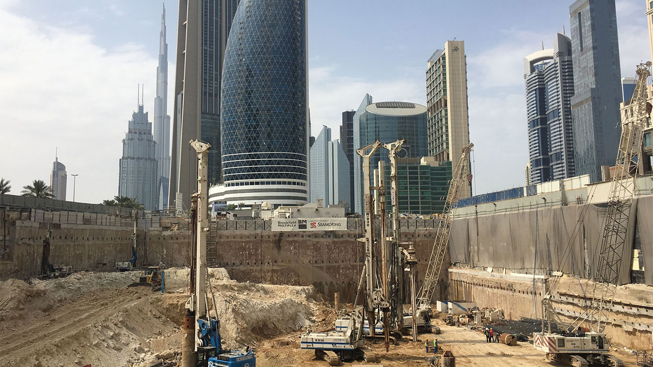 A construction site scene with workers and machinery