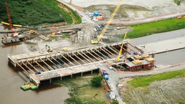 Aerial view of a construction site showing a bridge under construction